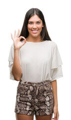 Poster - Young beautiful hispanic woman doing ok sign with fingers, excellent symbol