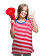© Krakenimages.com - Young beautiful girl yelling through megaphone over isolated background doing ok sign with fingers, excellent symbol