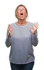 Sticker - Middle age senior hispanic woman over isolated background crazy and mad shouting and yelling with aggressive expression and arms raised. Frustration concept.