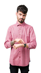 Poster - Young handsome man wearing pink shirt over isolated background In hurry pointing to watch time, impatience, upset and angry for deadline delay