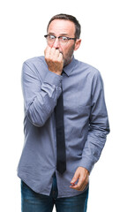 Poster - Middle age hoary senior business man wearing glasses over isolated background looking stressed and nervous with hands on mouth biting nails. Anxiety problem.