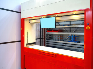 Poster - Automated storage system. Innovative warehouse. Offline storage area. Robotic warehouse. Computer screen near equipment for automatic product search. Automated warehouse with plastic trays