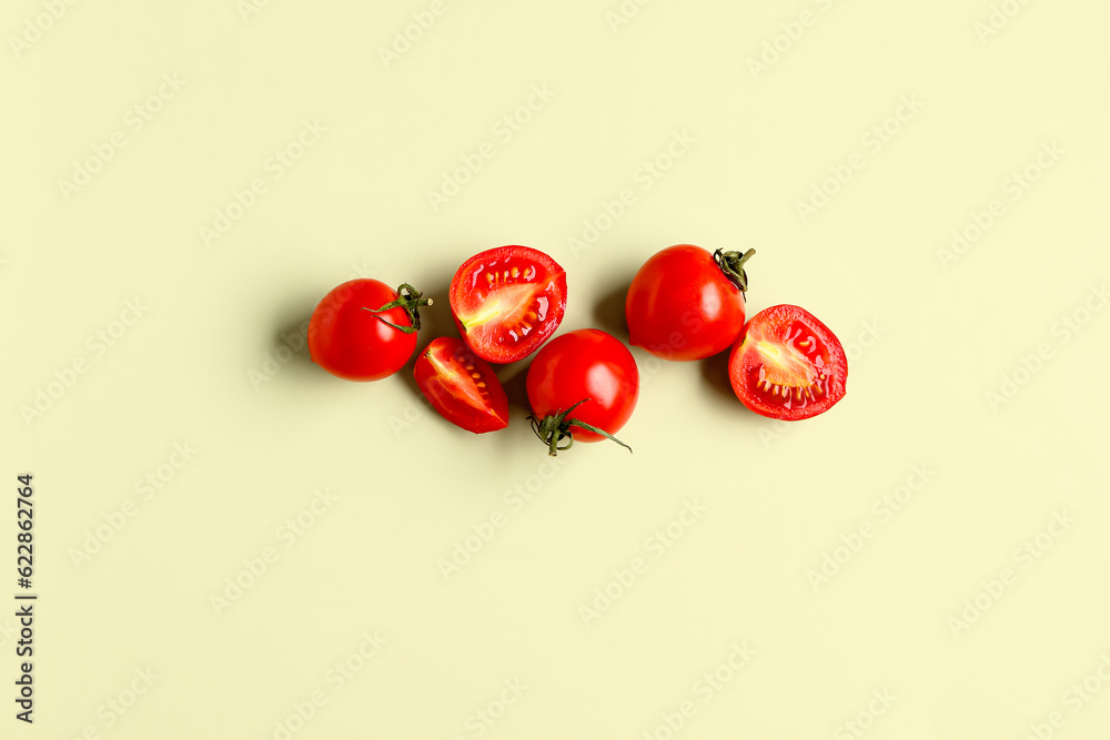 Fresh cherry tomatoes on light green background