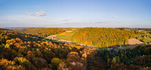 An Aerial Drone Panoramic View Of The Autumn Tree Colors As The Sun Sets On The Border Of Burgenland And Styria In Austria Under Scattered Clouds.