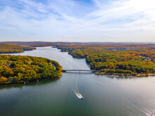 Aerial View Of A Sailboat At Deep Creek Lake In Autumn In McHenry Maryland, United States.