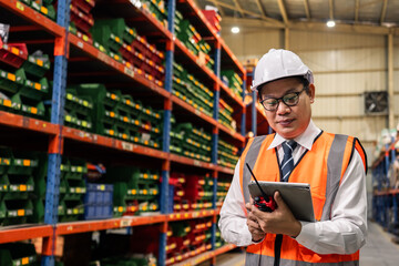 Wall Mural - Portrait of Asian man industrial worker working in manufacturing plant. 