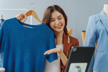 How To Start A Clothing Store Online Business Apparel! Young Confident Asian Female Fashion Owner Social Media Influencer Live Selling Clothes, New Products At Home Office Small Business E-commerce.