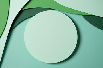 Wall Mural - Blank light green round geometric shape podium platform on paper cut abstract geometric shape green background. Top view mock up for product display