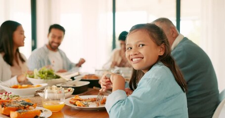 Wall Mural - Thanksgiving, smile and a girl with her family eating food together while bonding in celebration. Love, lunch or brunch with the portrait of a female child and relatives at the dining room table