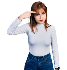 Poster - Redhead young woman wearing casual turtleneck sweater pointing unhappy to pimple on forehead, ugly infection of blackhead. acne and skin problem