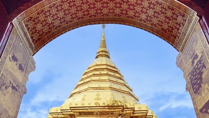 Wall Mural - Wat Phra That Doi Suthep and beautiful patterned red door against the blue sky and white clouds. Famous Temple of Chiang Mai, Thailand. 4K Zoom Out Shot.