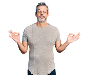 Poster - Middle age hispanic with grey hair wearing casual grey t shirt relax and smiling with eyes closed doing meditation gesture with fingers. yoga concept.