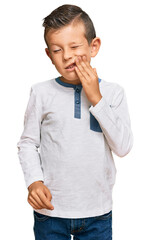 Poster - Adorable caucasian kid wearing casual clothes touching mouth with hand with painful expression because of toothache or dental illness on teeth. dentist