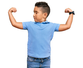 Poster - Little boy hispanic kid wearing casual clothes showing arms muscles smiling proud. fitness concept.