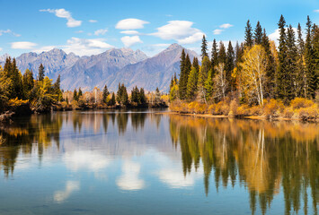 Wall Mural - beautiful autumn landscape with the eastern sayan mountains and yellowed trees on the banks of the i