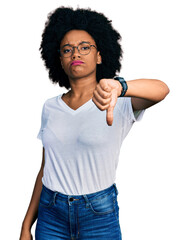 Poster - Young african american woman wearing casual white t shirt looking unhappy and angry showing rejection and negative with thumbs down gesture. bad expression.