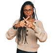 © Krakenimages.com - African american woman wearing casual clothes rejection expression crossing fingers doing negative sign