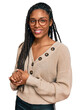 © Krakenimages.com - African american woman wearing casual clothes with hands together and crossed fingers smiling relaxed and cheerful. success and optimistic
