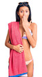 © Krakenimages.com - Young beautiful latin girl wearing bikini and sunglasses covering mouth with hand, shocked and afraid for mistake. surprised expression