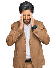 Wall Mural - Young hispanic man wearing business clothes with hand on head, headache because stress. suffering migraine.