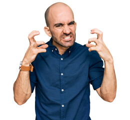 Poster - Young hispanic man wearing casual clothes shouting frustrated with rage, hands trying to strangle, yelling mad