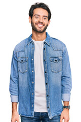 Poster - Young hispanic man wearing casual clothes with a happy and cool smile on face. lucky person.