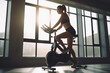 © Creative Clicks - Photo of Woman on stationary exercise bike