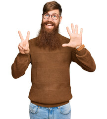 Canvas Print - Young irish redhead man wearing casual clothes and glasses showing and pointing up with fingers number seven while smiling confident and happy.