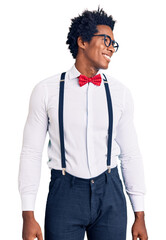 Poster - Handsome african american man with afro hair wearing hipster elegant look looking away to side with smile on face, natural expression. laughing confident.