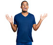 © Krakenimages.com - Young african american man wearing casual t shirt celebrating crazy and amazed for success with arms raised and open eyes screaming excited. winner concept