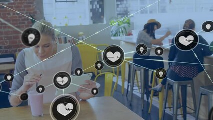 Poster - Animation of network of digital icons over caucasian woman drinking smoothie using tablet in a cafe