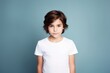 © Tuyres - Fictional child model wearing a plain white t-shirt. Isolated on colored background. Generative AI illustration.