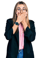 Sticker - Hispanic young woman wearing business jacket and glasses shocked covering mouth with hands for mistake. secret concept.