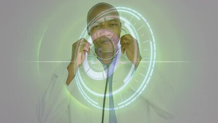 Canvas Print - Animation of loading circles, circular pattern, african american doctor using stethoscope on screen