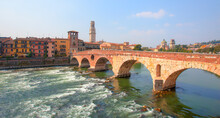 Panoramic View To Bridge Ponte Pietra In Verona On Adige River, Veneto Region, Italy.