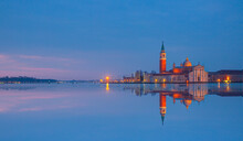 View Of San Giorgio Island In Venice With Wooden Buoys In Giudecca Canal  At Twilight Blue Hour - Venetian Gondolier 