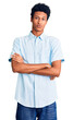 © Krakenimages.com - Young african american man wearing casual clothes skeptic and nervous, disapproving expression on face with crossed arms. negative person.