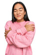 © Krakenimages.com - Young asian woman wearing casual winter sweater hugging oneself happy and positive, smiling confident. self love and self care