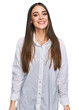 © Krakenimages.com - Young beautiful woman wearing casual white shirt looking positive and happy standing and smiling with a confident smile showing teeth