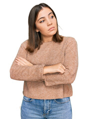 Canvas Print - Young beautiful woman wearing casual clothes looking to the side with arms crossed convinced and confident