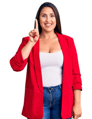 Sticker - Young beautiful brunette woman wearing elegant clothes showing and pointing up with finger number one while smiling confident and happy.