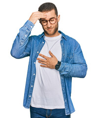 Poster - Young caucasian man wearing casual clothes touching forehead for illness and fever, flu and cold, virus sick