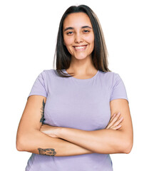 Young hispanic woman wearing casual clothes happy face smiling with crossed arms looking at the camera. positive person.