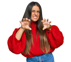 Wall Mural - Beautiful hispanic woman wearing casual clothes smiling funny doing claw gesture as cat, aggressive and sexy expression