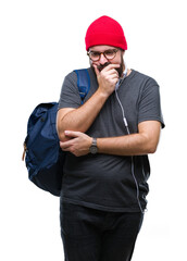 Poster - Young hipster man wearing red wool cap and backpack over isolated background thinking looking tired and bored with depression problems with crossed arms.