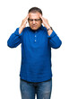 © Krakenimages.com - Middle age arab man wearing glasses over isolated background with hand on head for pain in head because stress. Suffering migraine.