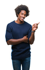 Wall Mural - Afro american man over isolated background with a big smile on face, pointing with hand and finger to the side looking at the camera.