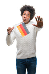 Wall Mural - Afro american man flag of Germany over isolated background with open hand doing stop sign with serious and confident expression, defense gesture