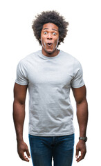 Sticker - Afro american man over isolated background afraid and shocked with surprise expression, fear and excited face.