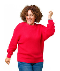 Sticker - Beautiful middle ager senior woman red winter sweater over isolated background Dancing happy and cheerful, smiling moving casual and confident listening to music